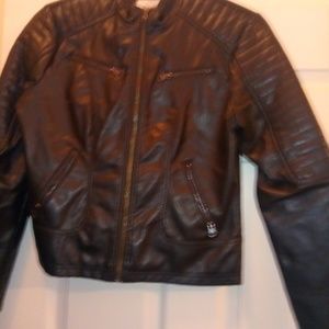 Leather jacket and fur vest